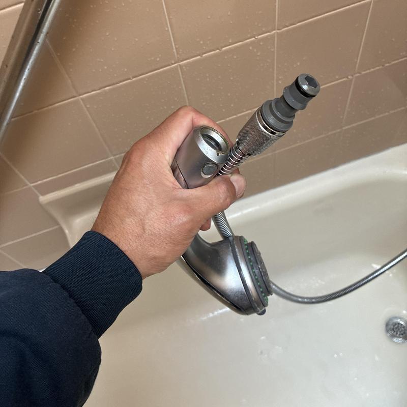 Shower handheld hose connection leak repair in tub
