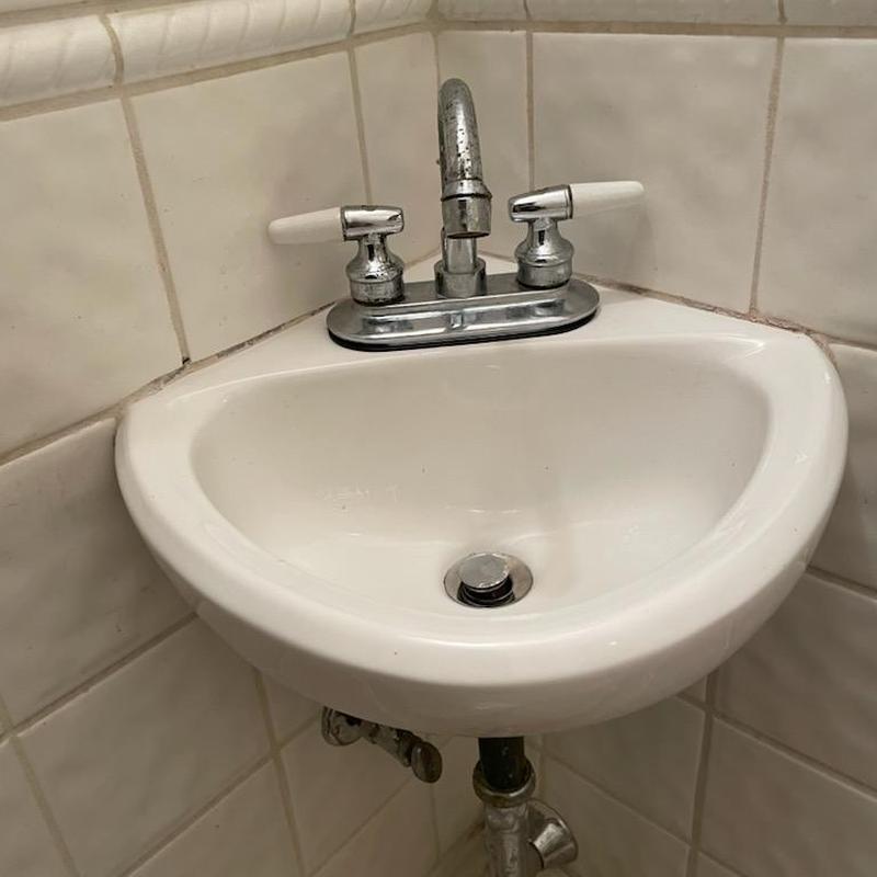 Bathroom sink faucet with dual handles installed