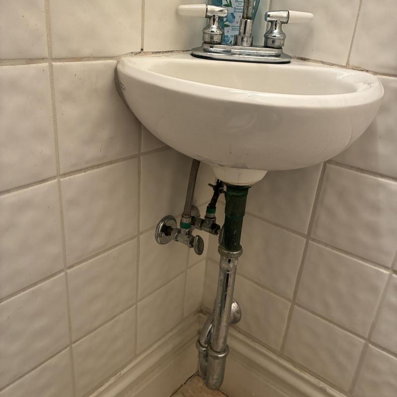 Bathroom sink faucet with valve and drain piping