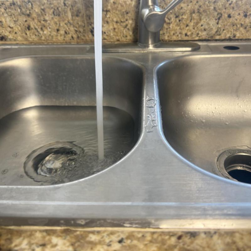 Garbage disposal drain flow in stainless sink bowl