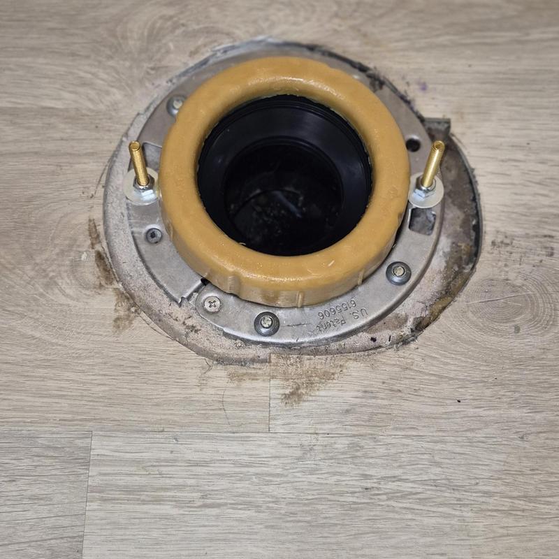 Toilet flange installation on wood flooring