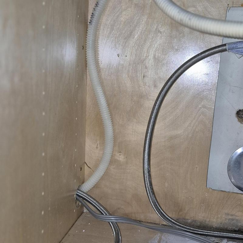 Dishwasher water supply connection under sink