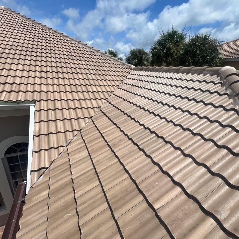 Concrete tile roof with exhaust fan and solar equipment Concrete tile roof with exhaust fan and solar equipment