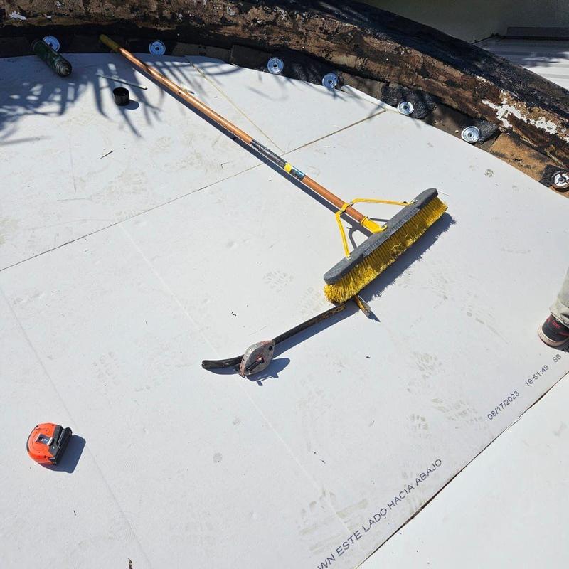 Flat roof membrane installation with tools on surface Flat roof membrane installation with tools on surface