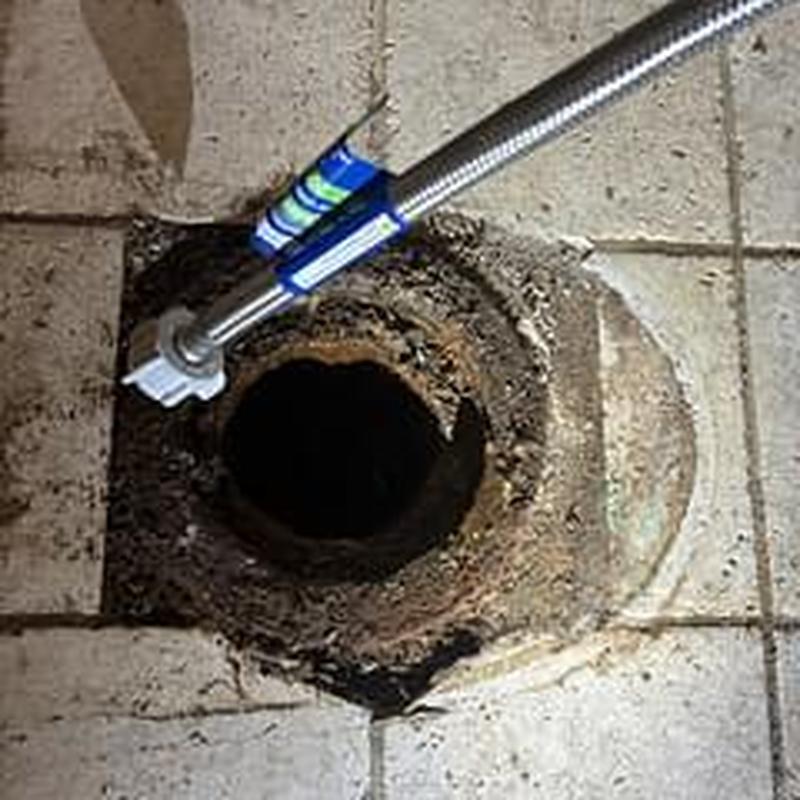 Main sewer line cleaning with cable access tool