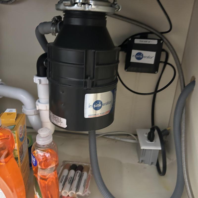 Garbage disposal unit under kitchen sink with wiring Garbage disposal unit under kitchen sink with wiring