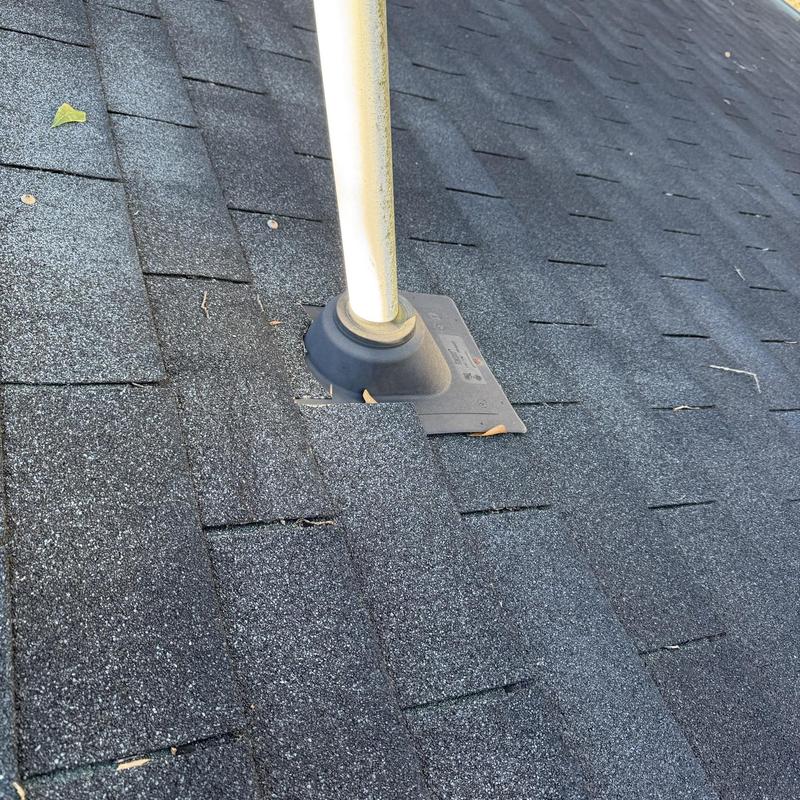 Asphalt shingle roof pipe flashing with vent pipe