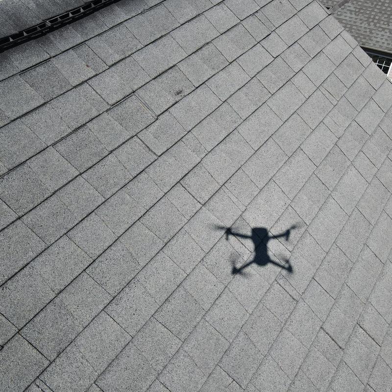Asphalt shingle roof with drone inspection shadow