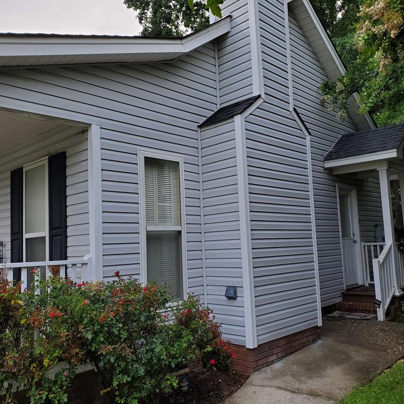 Vinyl siding installation on residential home exterior