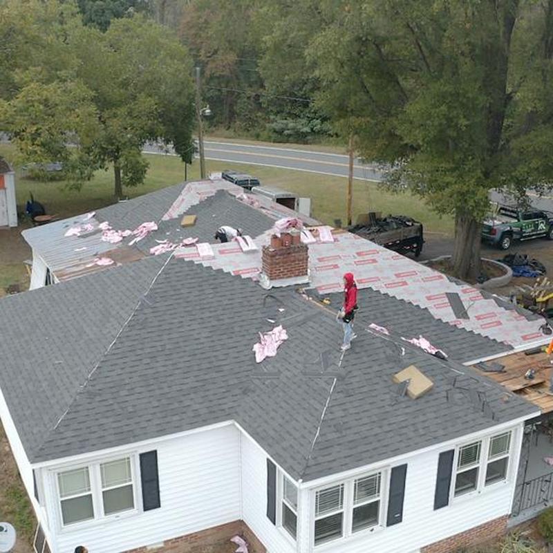 Roof shingles installation on residential house roof
