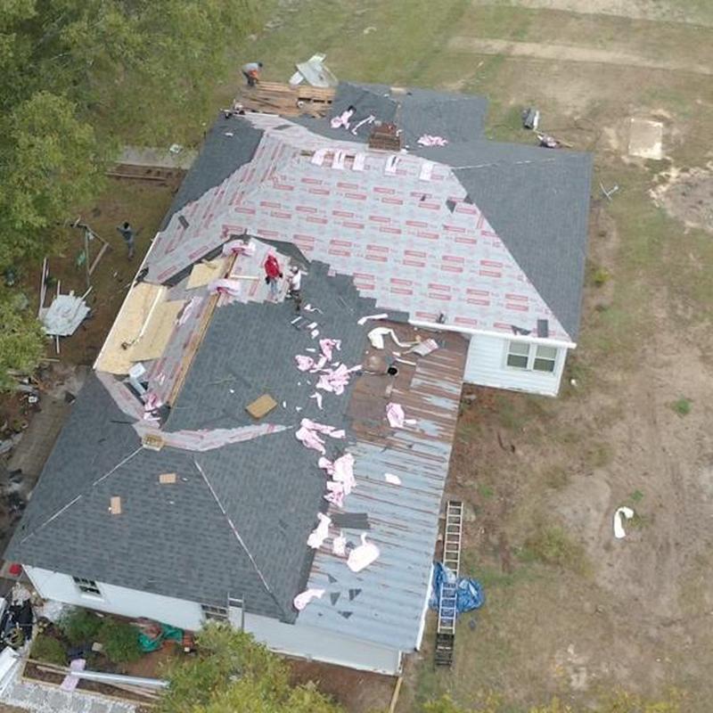 Roof shingles and gutters replacement in progress