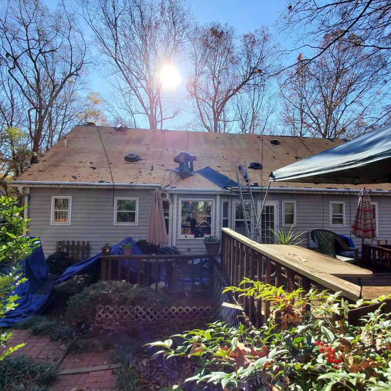 Wood roof decking installation on residential house