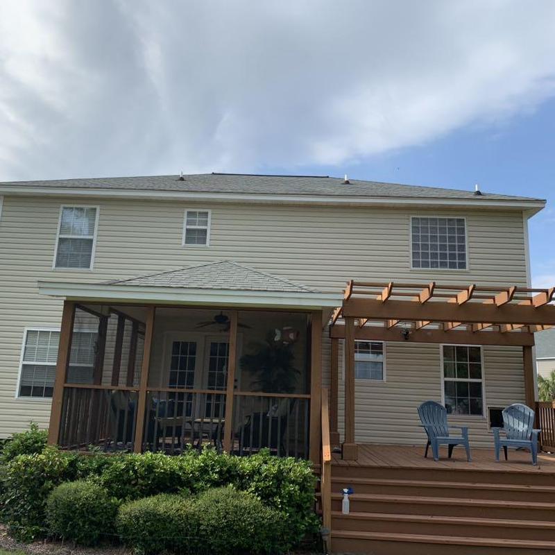 Exterior screened porch with wooden deck and pergola