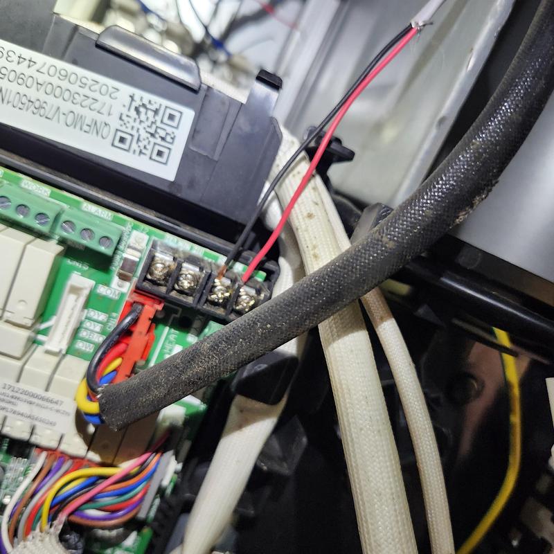 Heat pump control board wiring and connections close-up Heat pump control board wiring and connections close-up