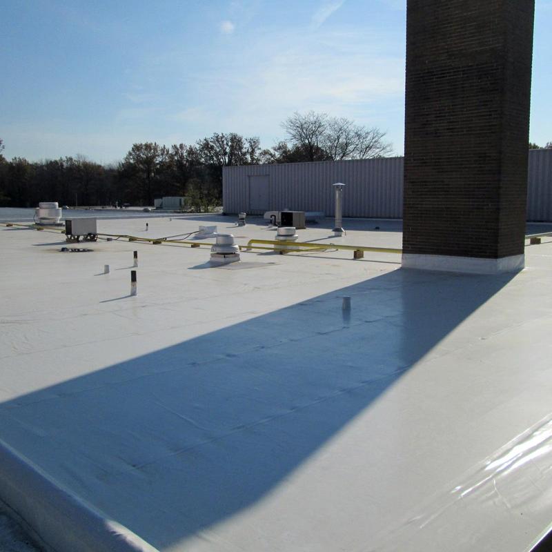 Commercial flat roof membrane with vents and pipes Commercial flat roof membrane with vents and pipes