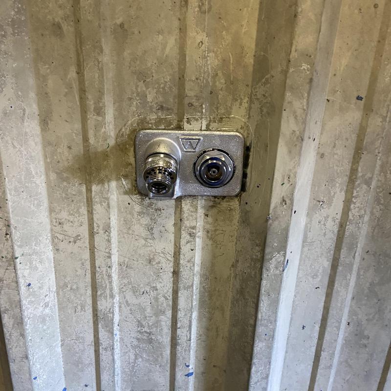 Commercial frost-free hose faucet on metal wall Commercial frost-free hose faucet on metal wall