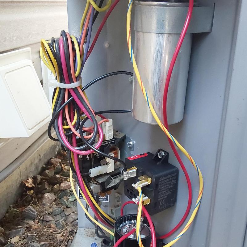 Voltage absorption capacitor and compressor saver in AC unit