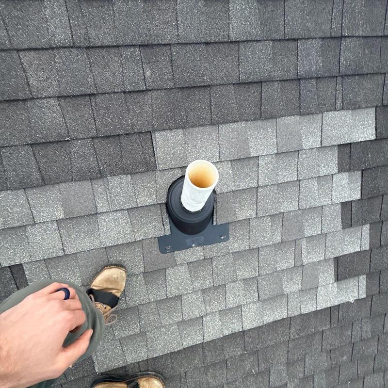 Roof vent pipe flashing on asphalt shingle roof