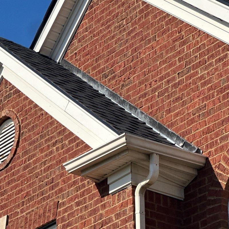 Asphalt shingle roof and gutter system with flashing