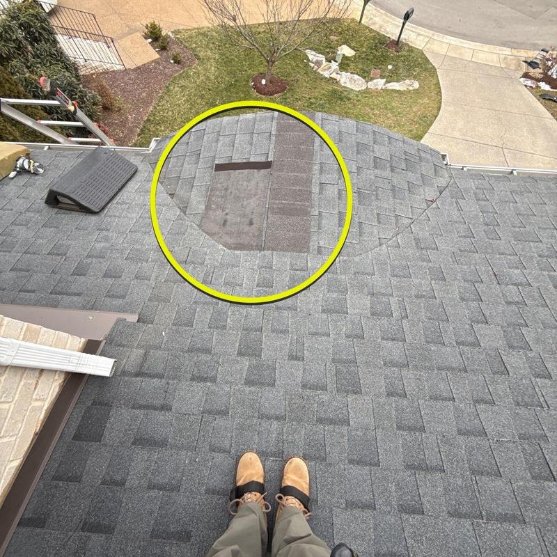Roof shingles missing showing exposed underlayment