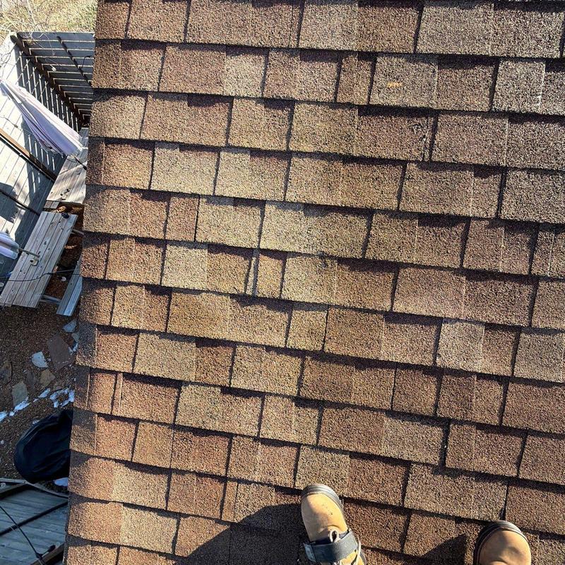 Asphalt shingles with hail damage on residential roof