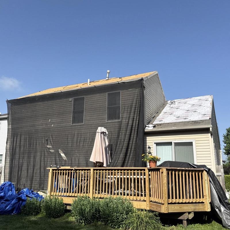 Asphalt shingle roof replacement with underlayment in progress Asphalt shingle roof replacement with underlayment in progress