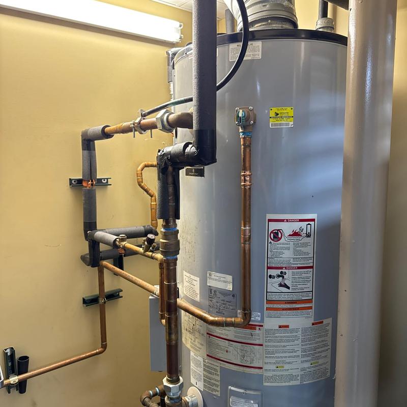 Water heater with new expansion tank installation and piping
