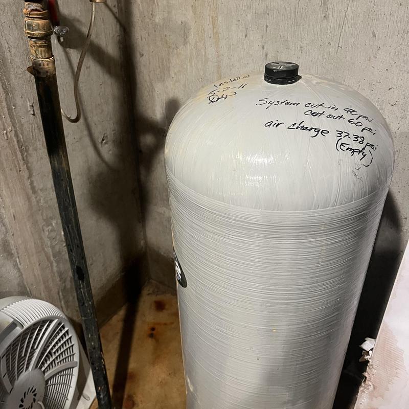 Well pressure tank with hand-written inspection notes