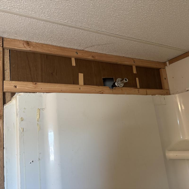 Shower enclosure framing and plumbing rough-in