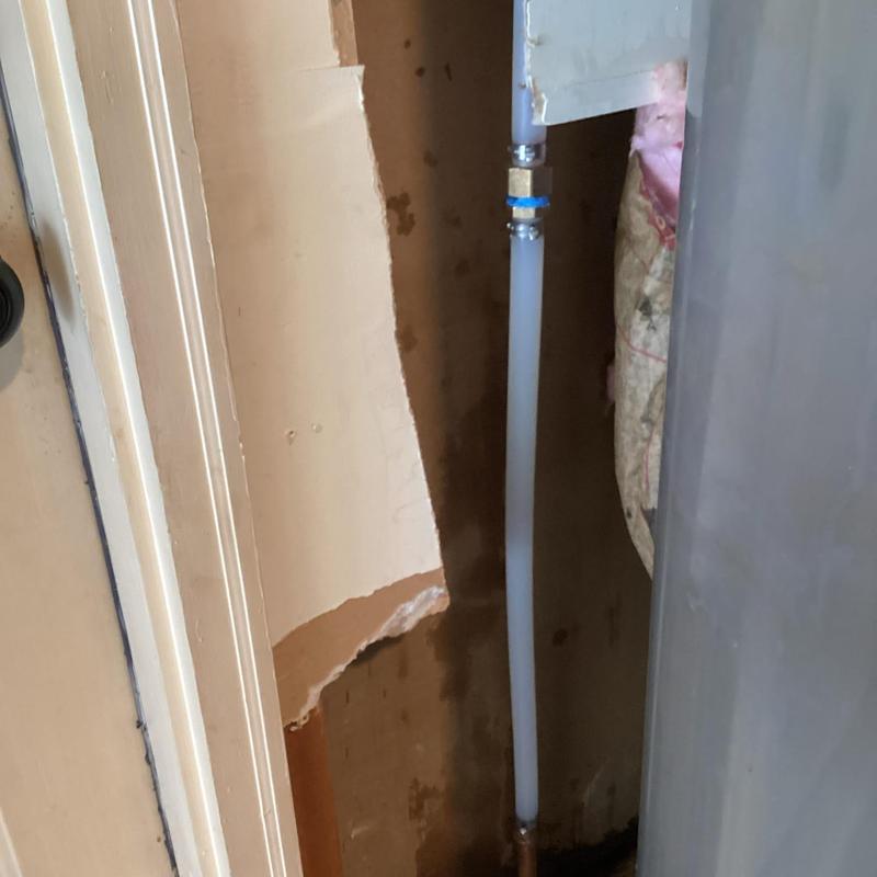 Water heater supply line with new fitting installed