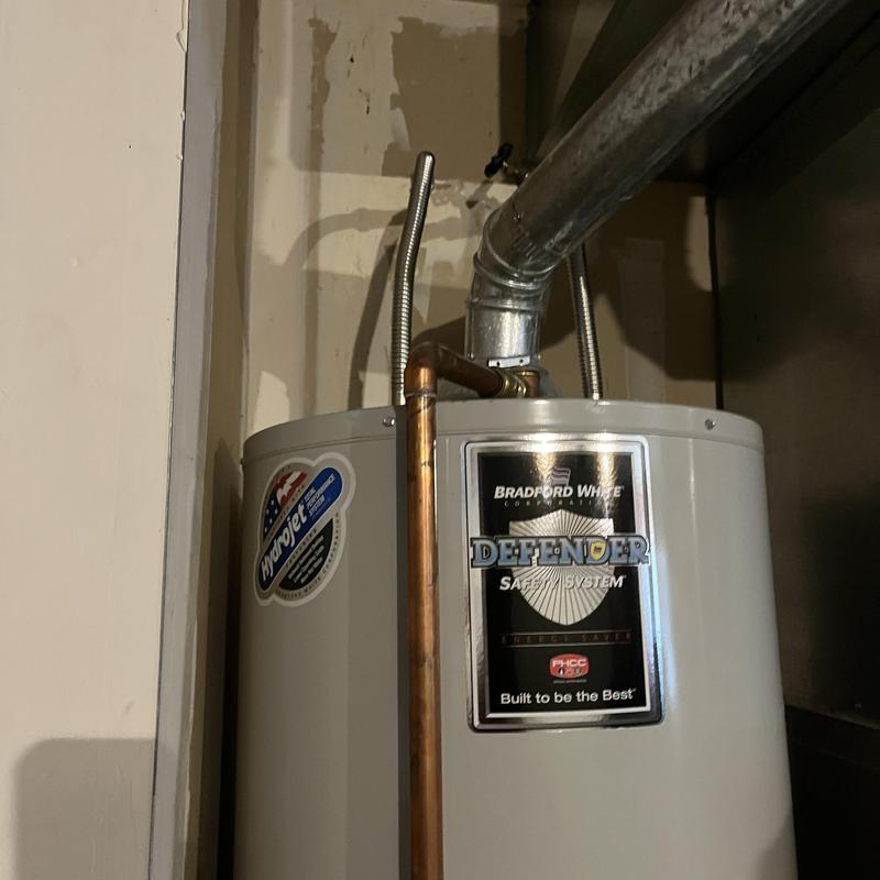 Water heater installation with copper piping and vent