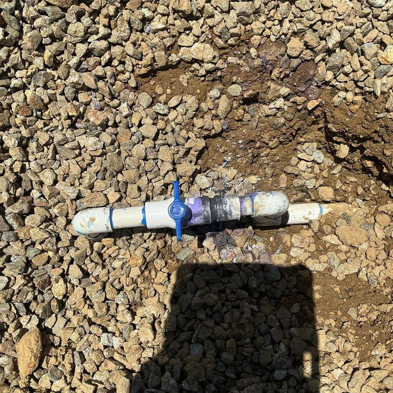Ball valve with PVC pipe in gravel trench