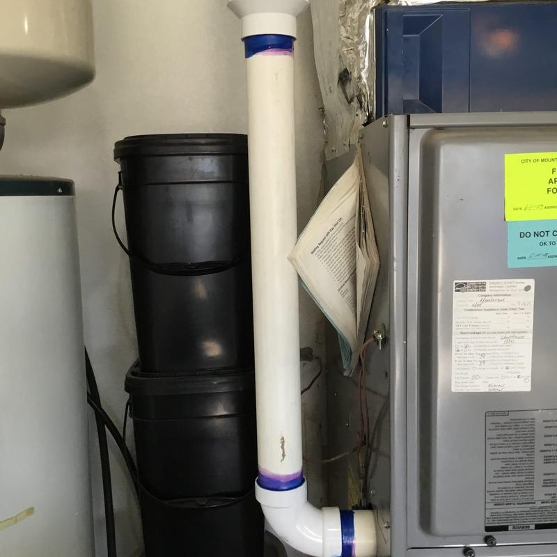PVC exhaust pipe with glue joint repair near furnace PVC exhaust pipe with glue joint repair near furnace