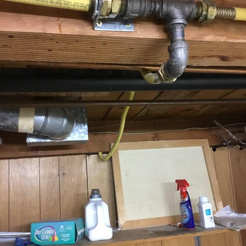 Steel gas line installed through wood beam in basement Steel gas line installed through wood beam in basement