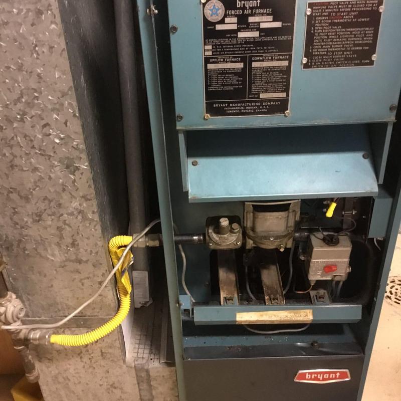 Propane furnace with yellow gas flex line connection Propane furnace with yellow gas flex line connection