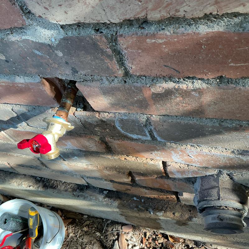 Quarter turn hose bib installation on brick wall extension