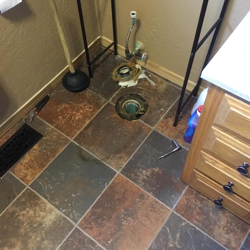 Toilet flange and main sewer line opening in bathroom floor Toilet flange and main sewer line opening in bathroom floor