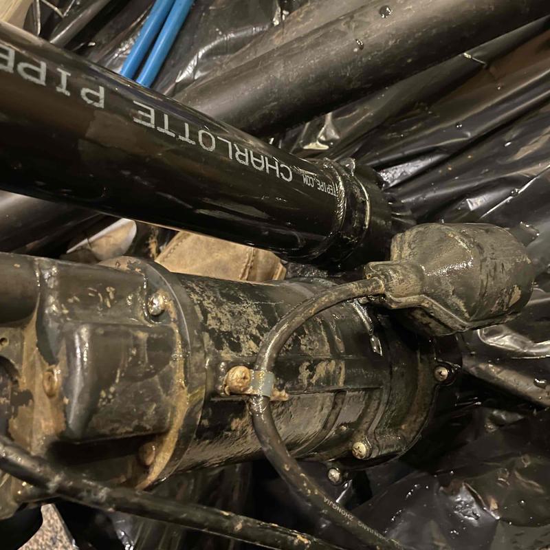 Sewage ejector pump with connected lift tubes in lift station Sewage ejector pump with connected lift tubes in lift station