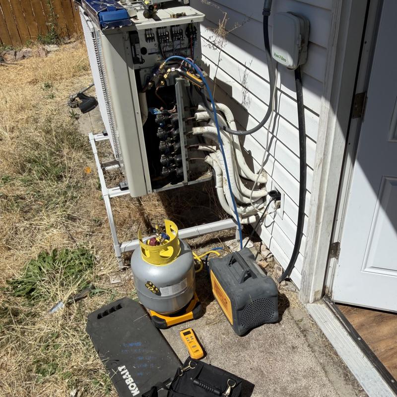 Mini-split AC system with refrigerant tools setup outdoors Mini-split AC system with refrigerant tools setup outdoors