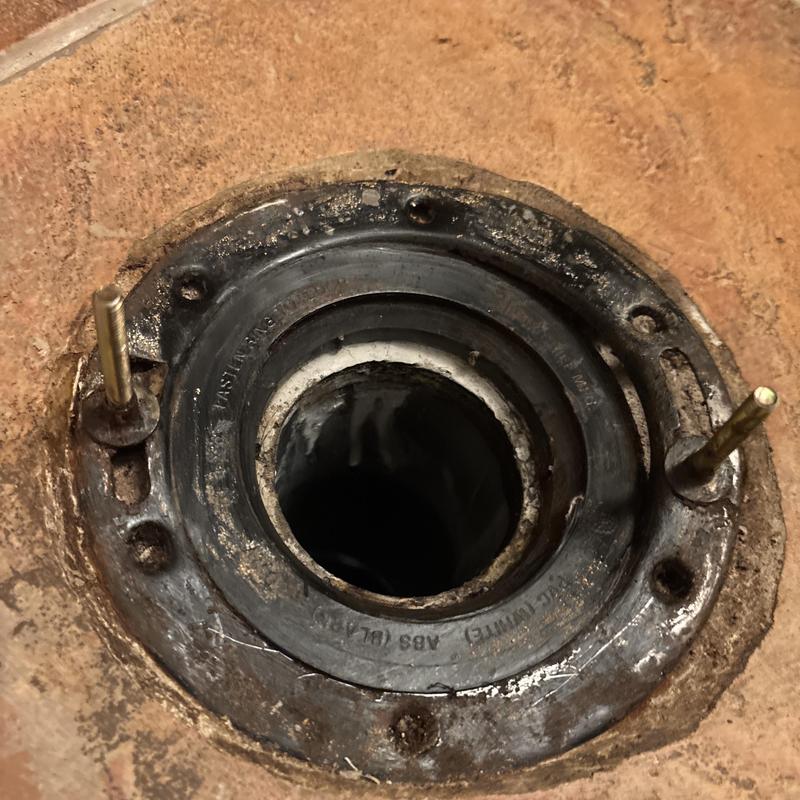 Toilet flange close-up with angle stop installation