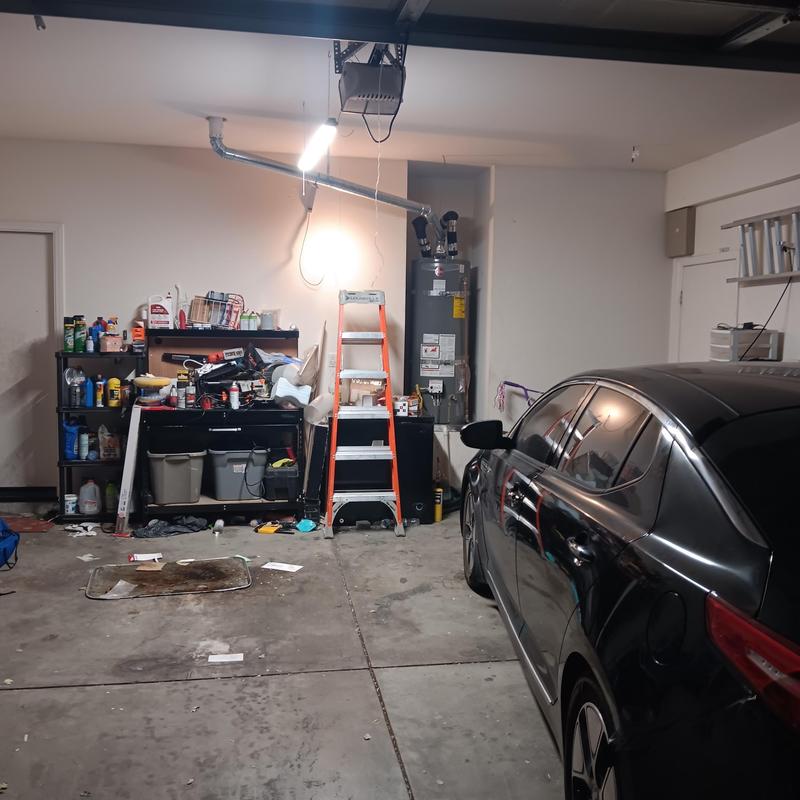 Water heater and copper repiping in garage workspace
