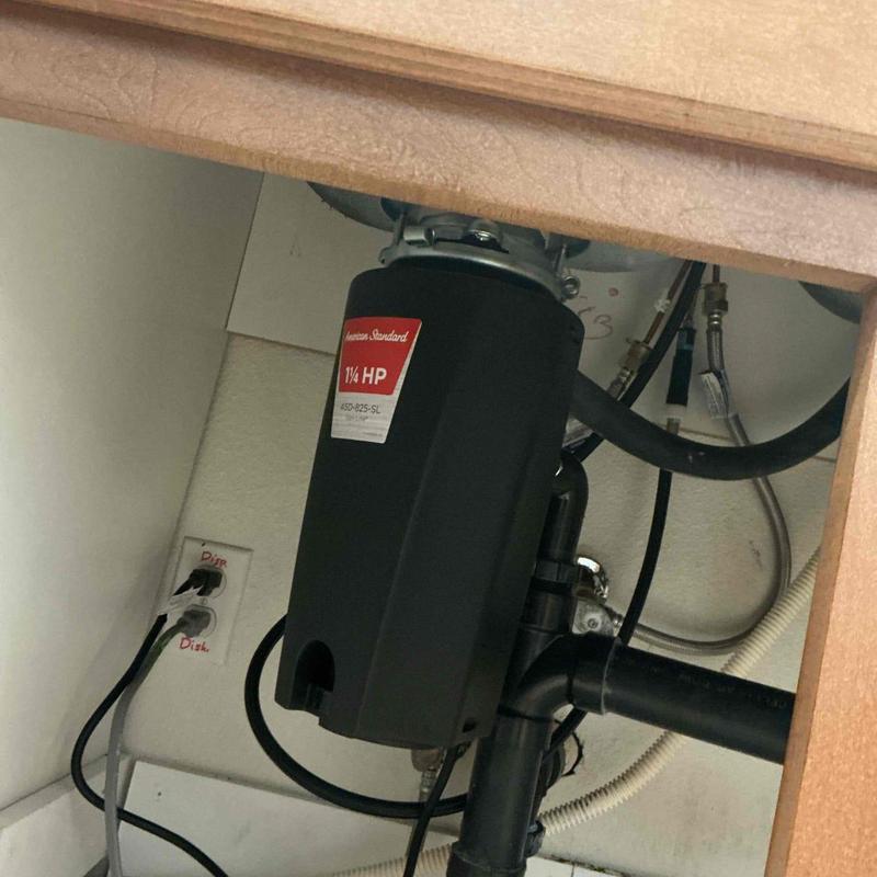 Garbage disposal installation under kitchen sink