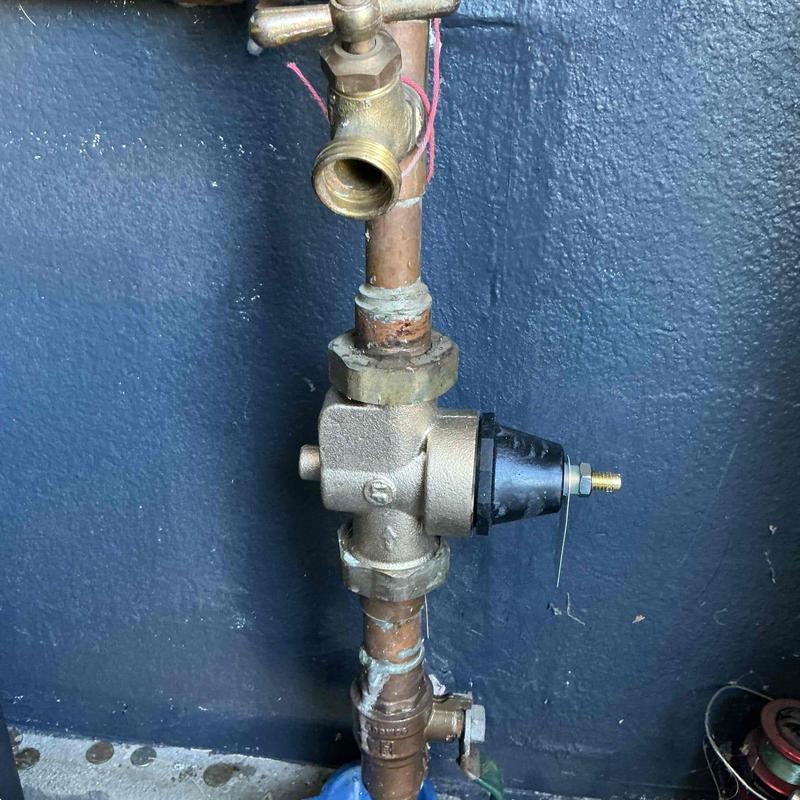 Pressure regulator valve on copper piping system