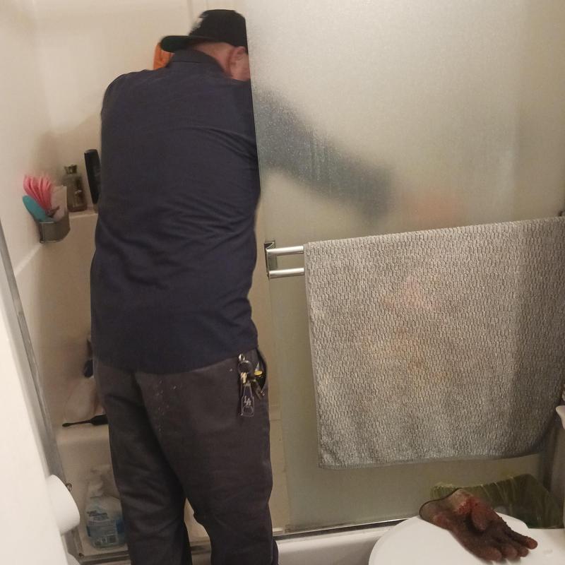 Shower drain with CCTV inspection by plumber in bathroom