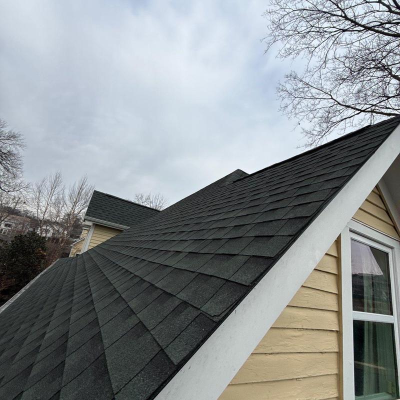 Asphalt shingle roof with hail damage inspection