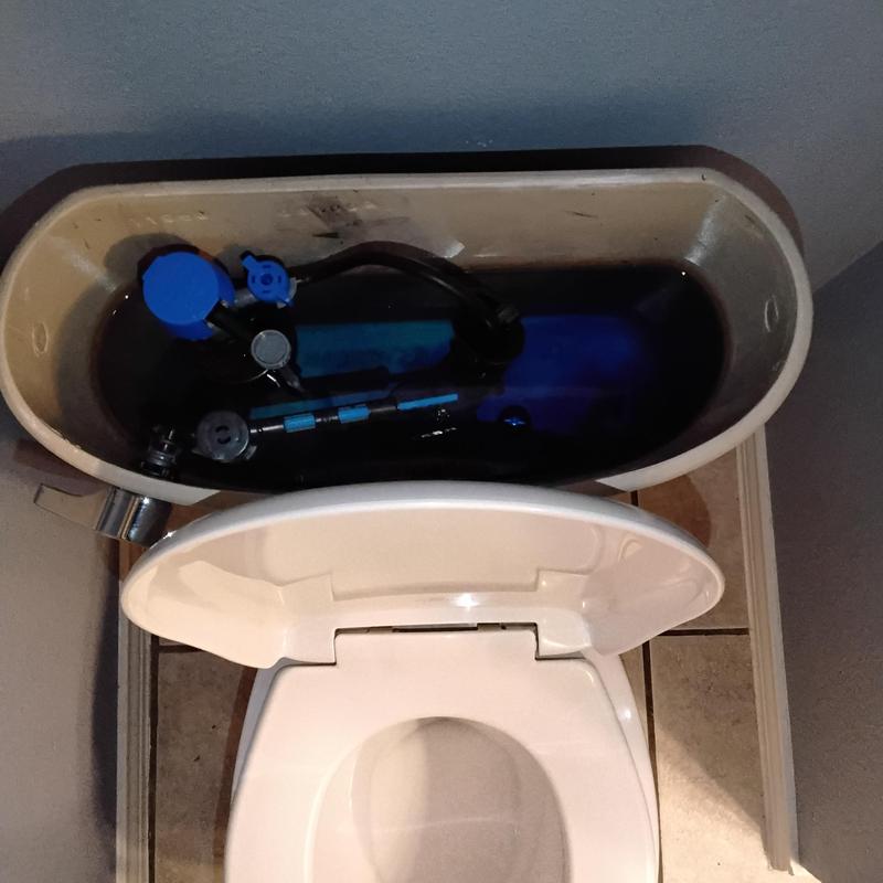 Toilet tank flush and fill valve assembly inside tank