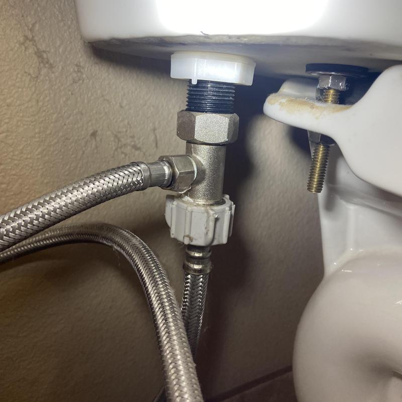 Toilet tank to bowl connection with water supply hose Toilet tank to bowl connection with water supply hose