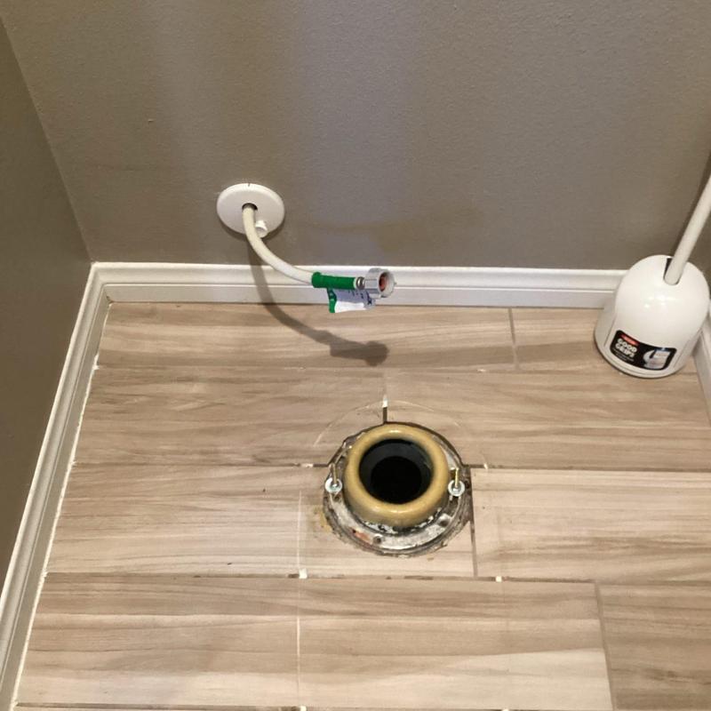 Toilet flange and water supply line installation setup
