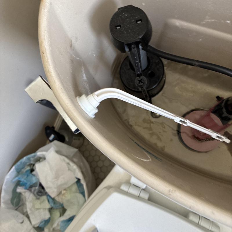 Toilet fill valve and flapper inside tank maintenance