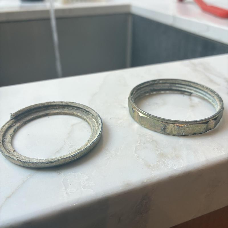 Slip-joint nut and washer from kitchen sink drain